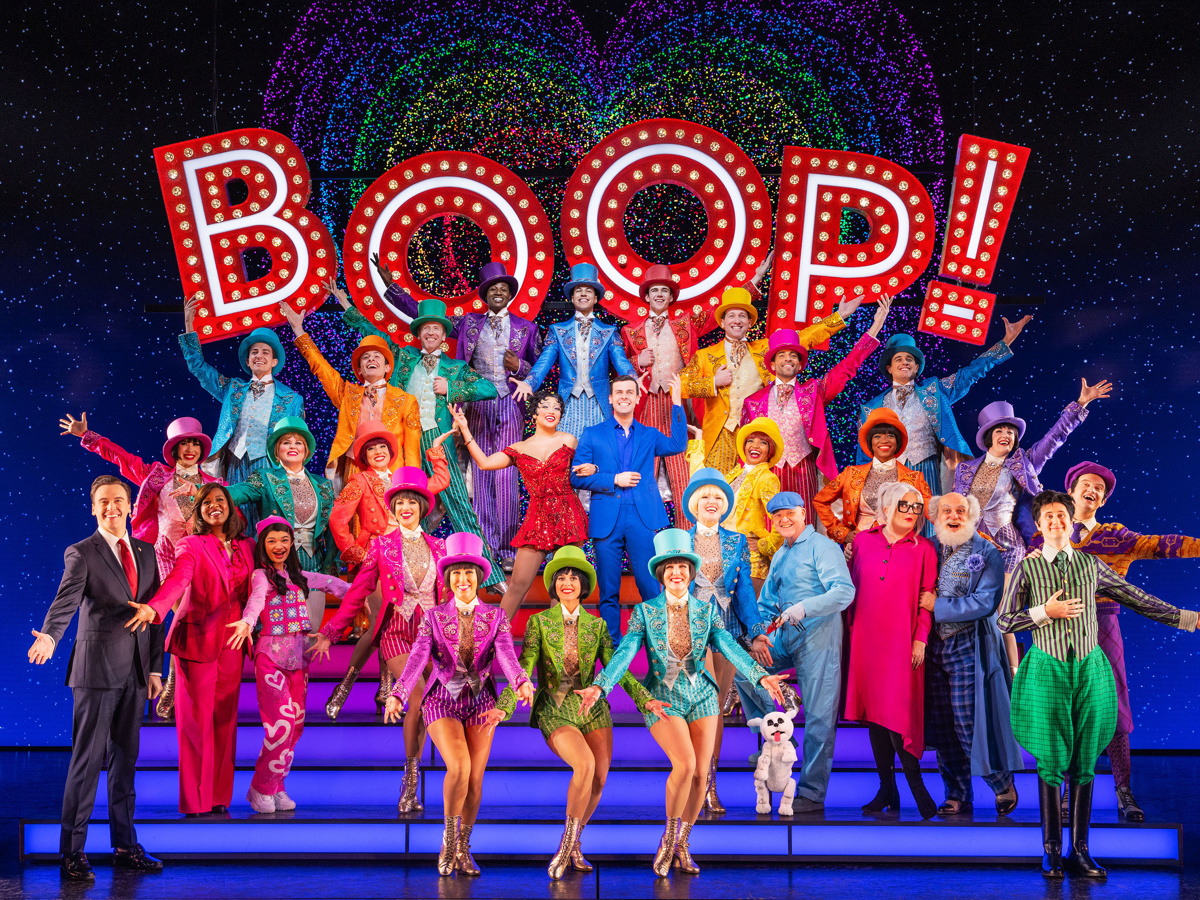 Ben Jackson Walker as Romeo and Lorna Courtney as Juliet stare at each other in & Juliet